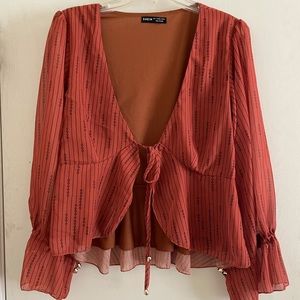 Long sleeve tie front top with sheer sleeves